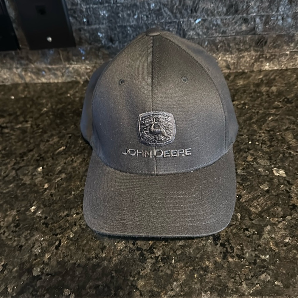 Black John Deere cap. Never worn. Size L /XL